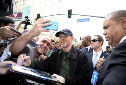 Ron Howard poses for a photograph with a fan after he was honoured with the 2,568th star on the Hollywood Walk of Fame in Los Angeles, California, December 10, 2015. REUTERS/Kevork Djansezian